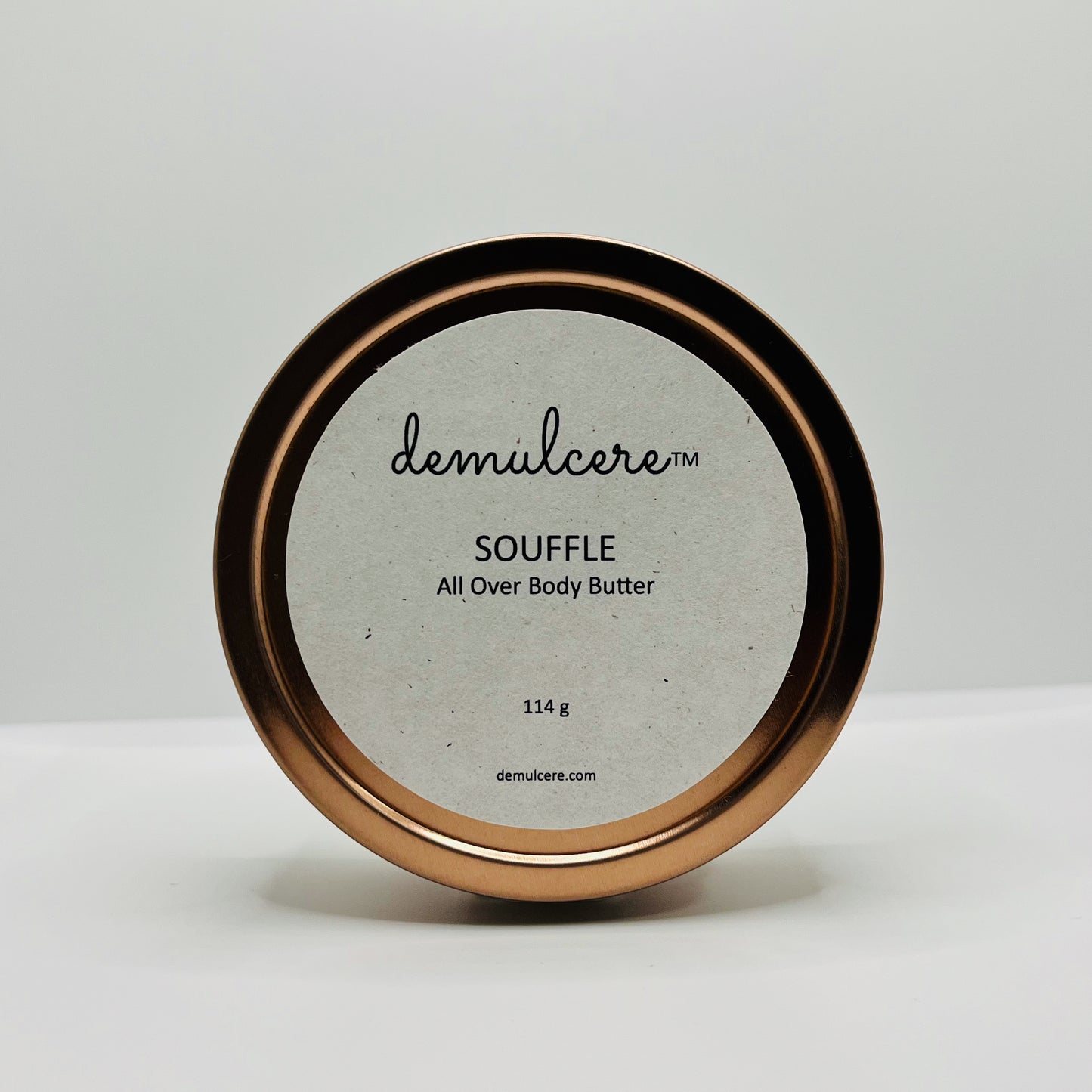 114g body butter in round rose gold tin on white background